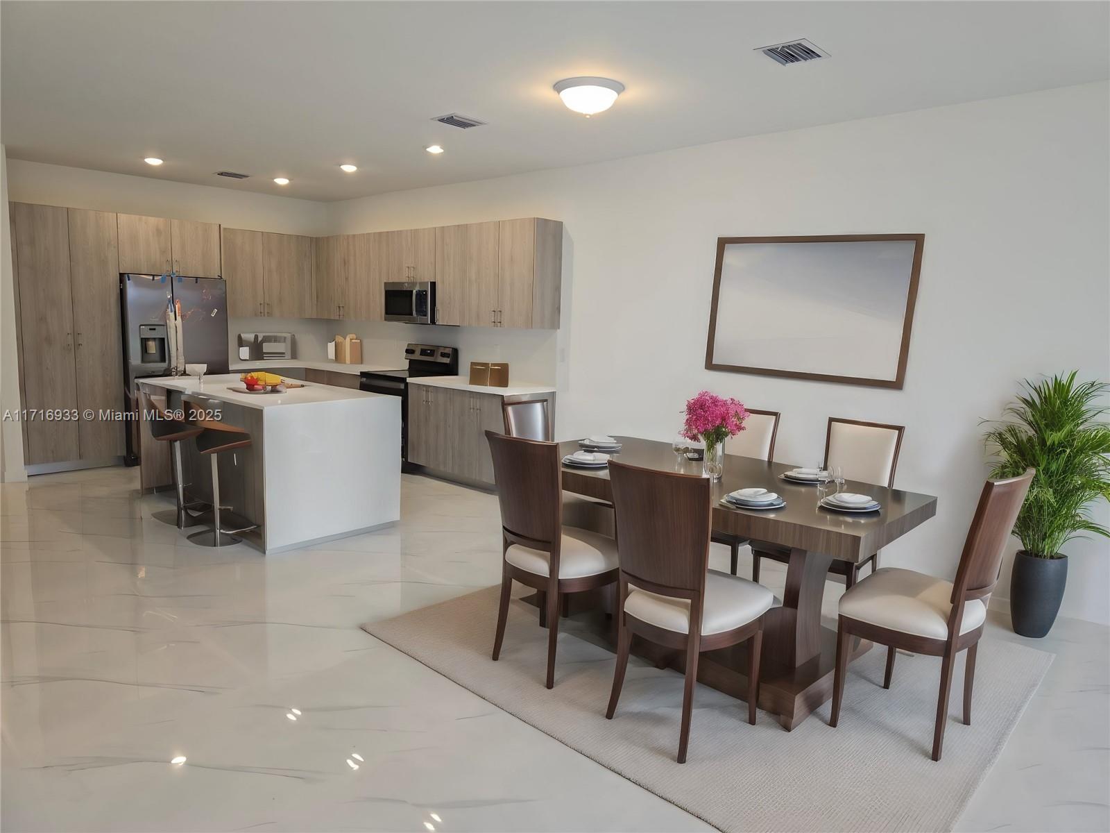 a view of kitchen with furniture dining table and chairs