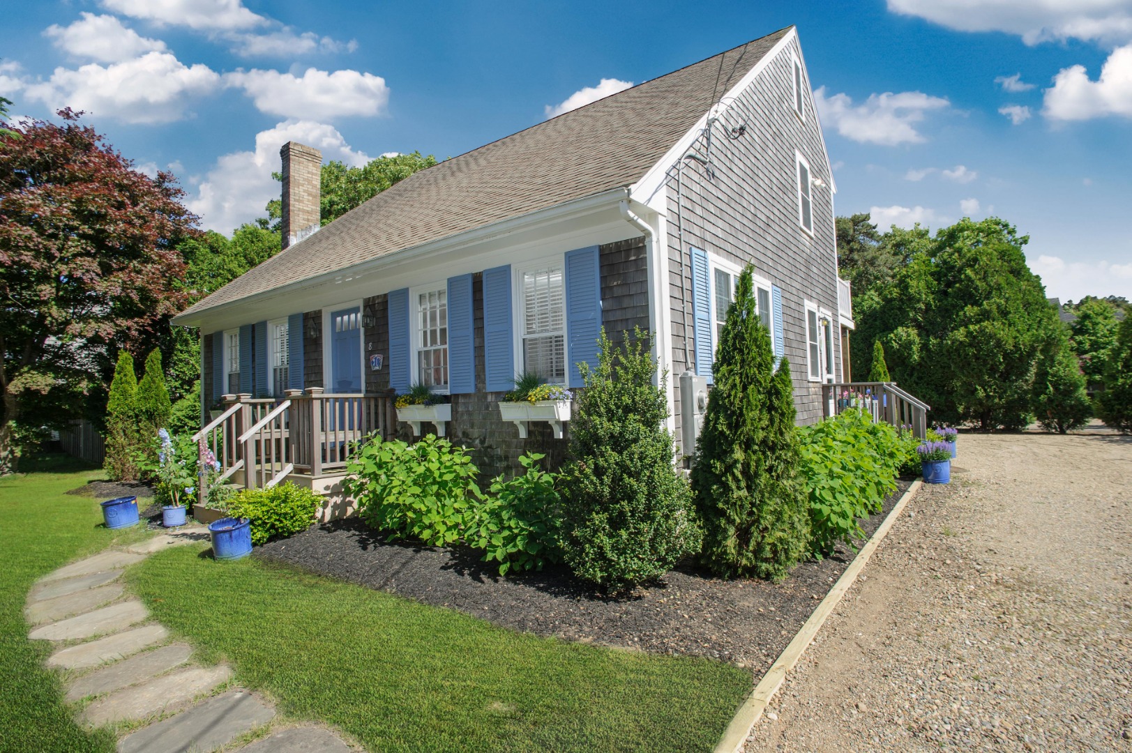 a front view of a house with garden