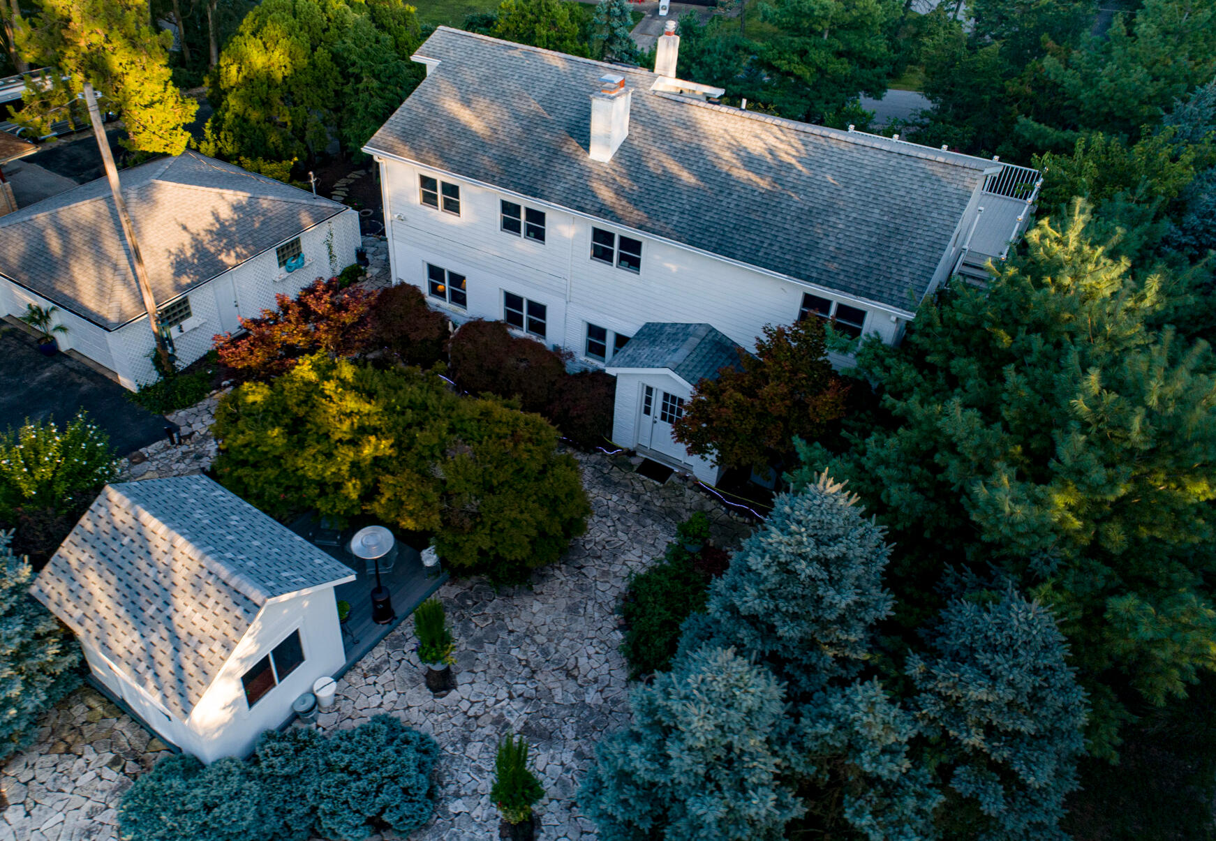 an aerial view of a house with a yard and a house