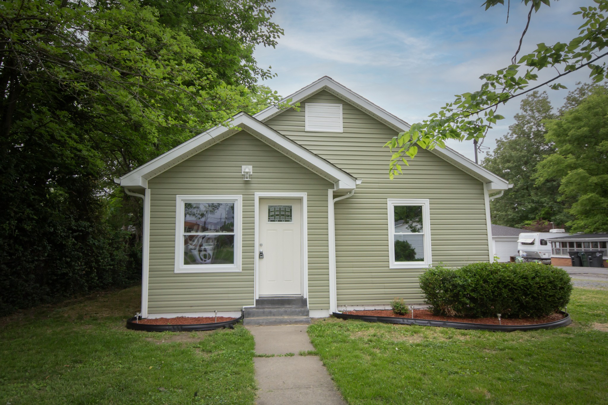 a front view of a house with a yard