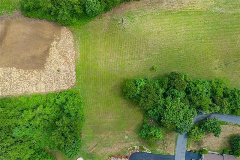 a view of a lake with a yard