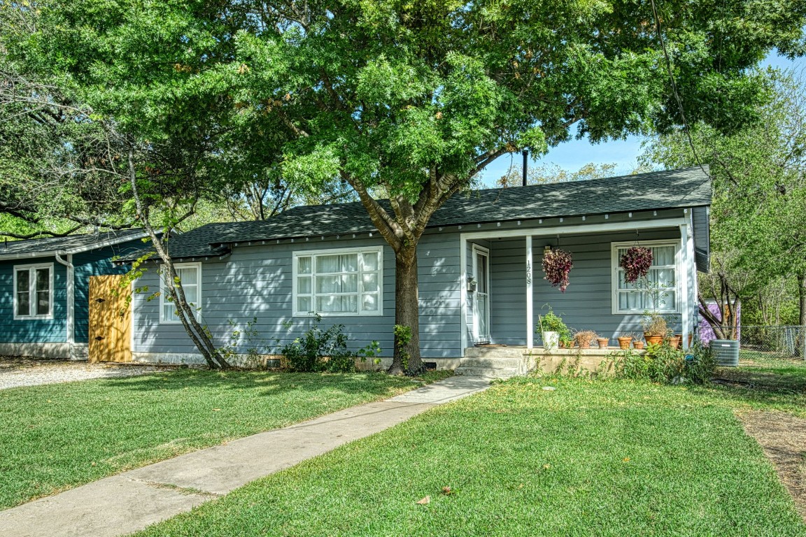 front view of a house with a yard