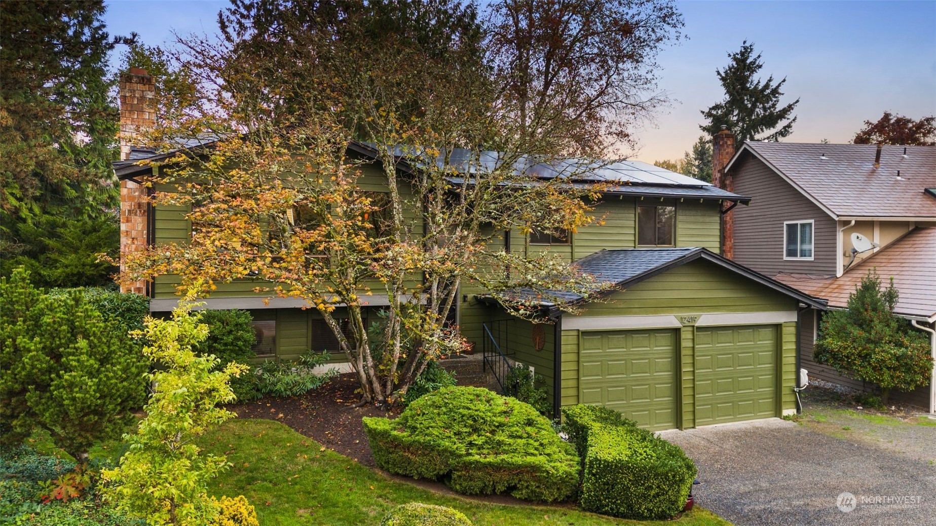 front view of a house with a garden