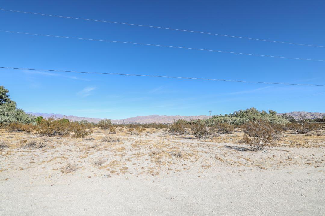 a view of ocean beach and mountain