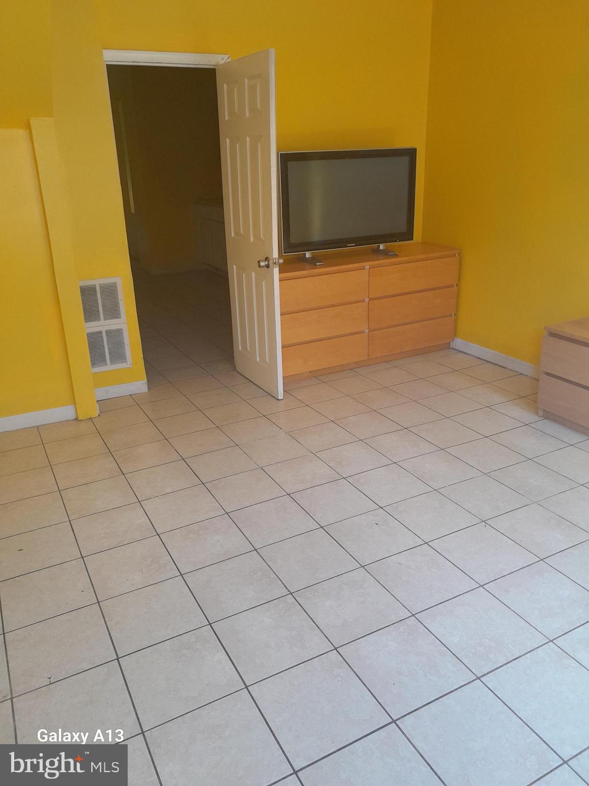 a living room with a couch and dryer