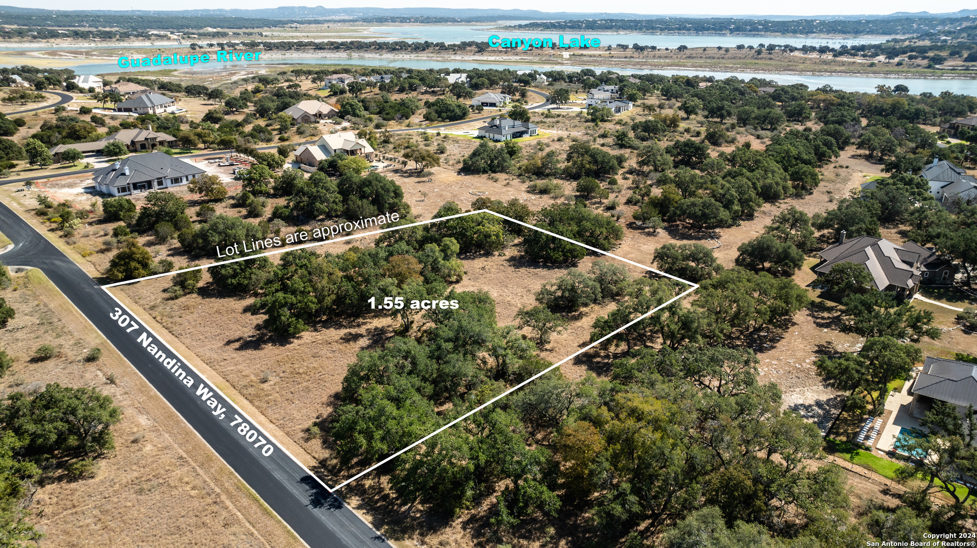 an aerial view of a residential houses with city view