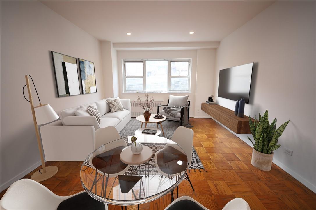 a living room with furniture and a potted plant