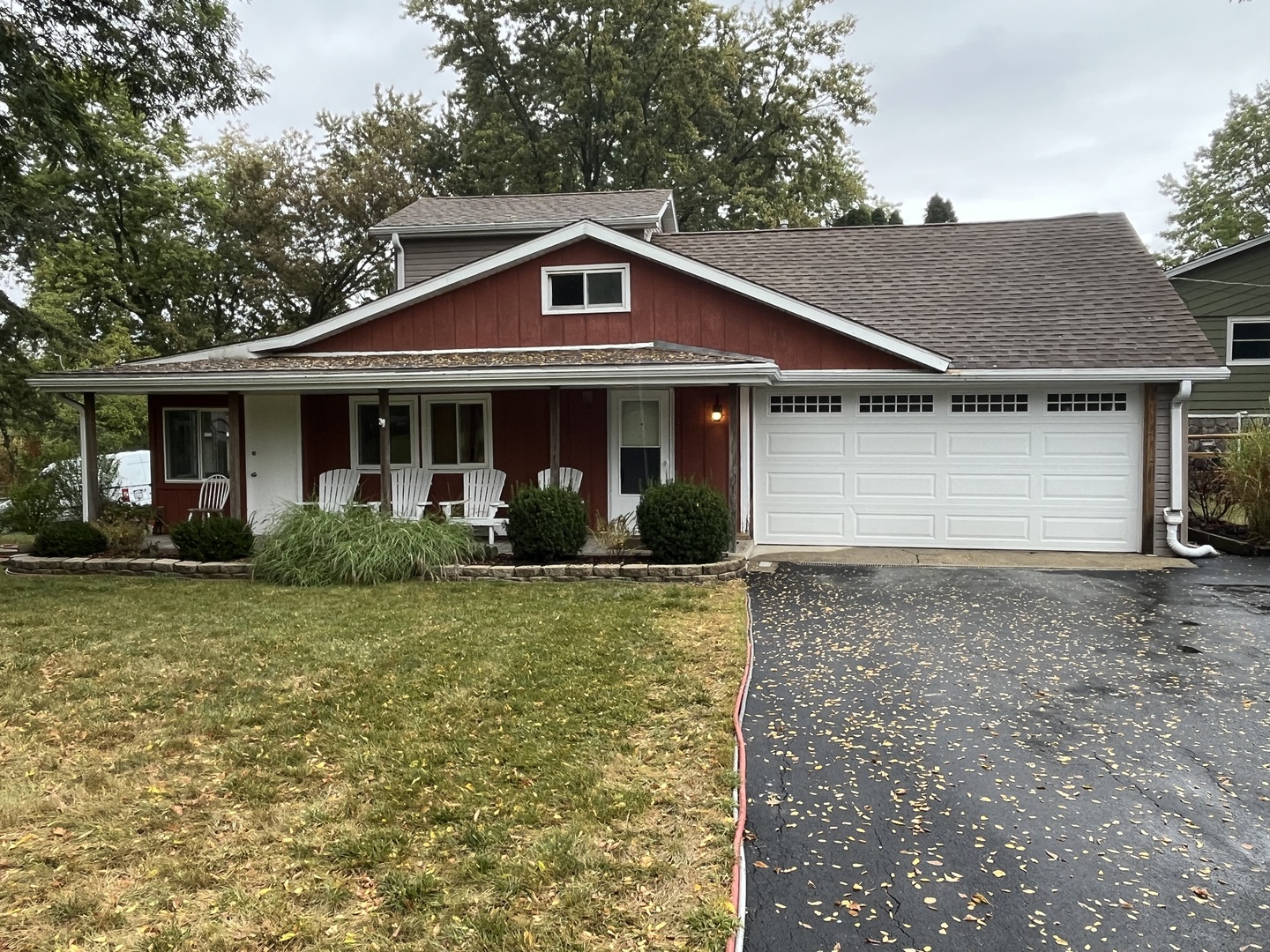 a front view of house with yard and trees