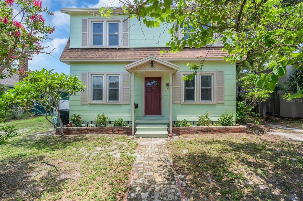 front view of a house with a yard