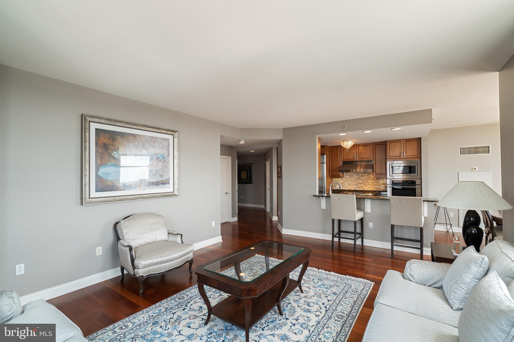 a living room with furniture and a rug