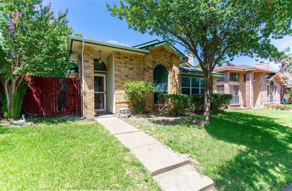 front view of a house with a yard