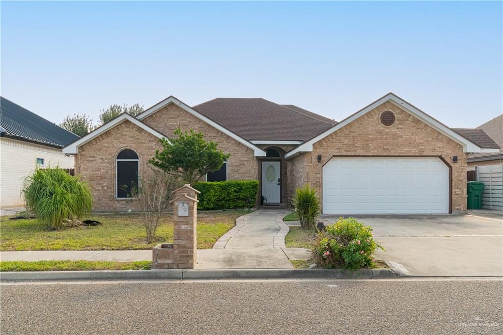 Single story home featuring a garage