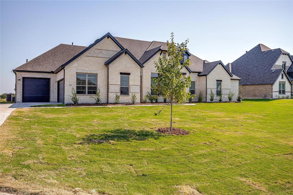 a front view of house with yard and swimming pool