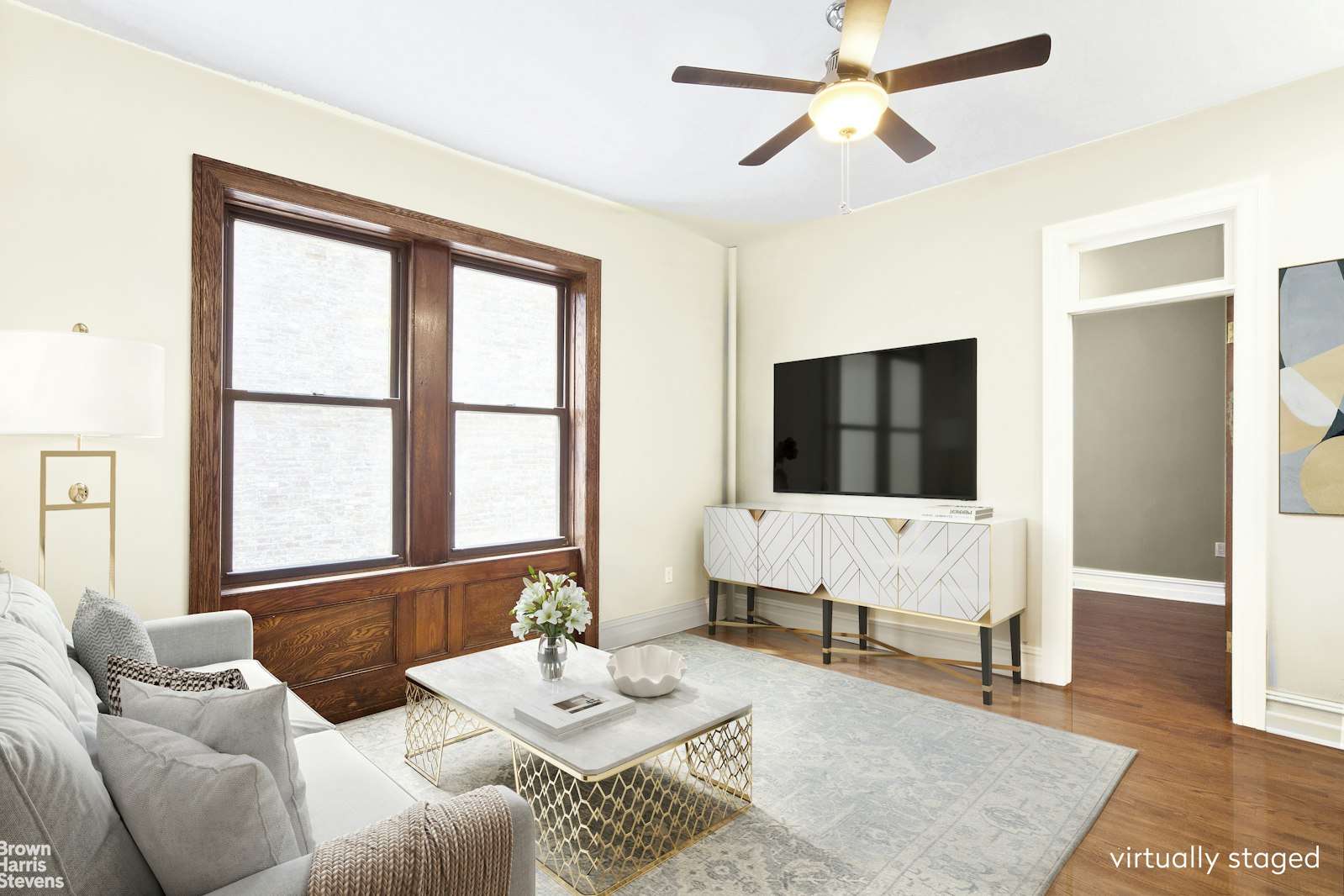 a living room with furniture and a flat screen tv