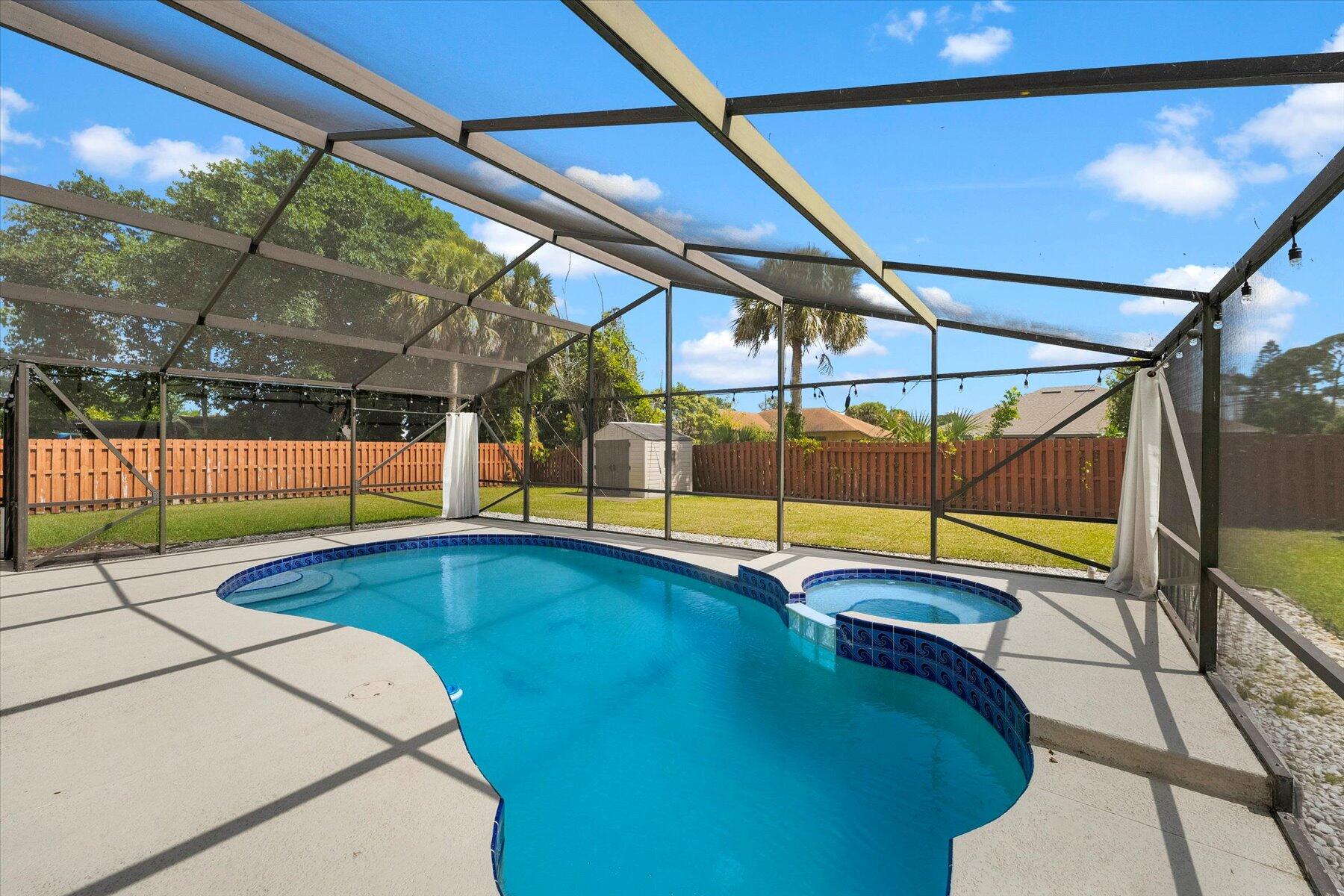 a view of swimming pool with seating area