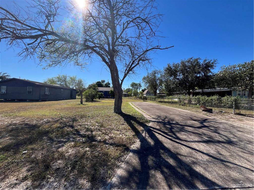 a view of a yard with an trees