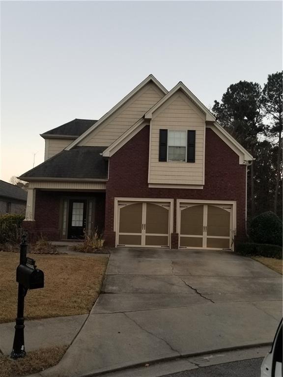 a front view of a house with garage