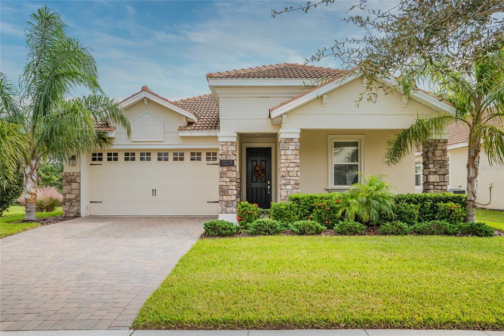 front view of a house with a yard