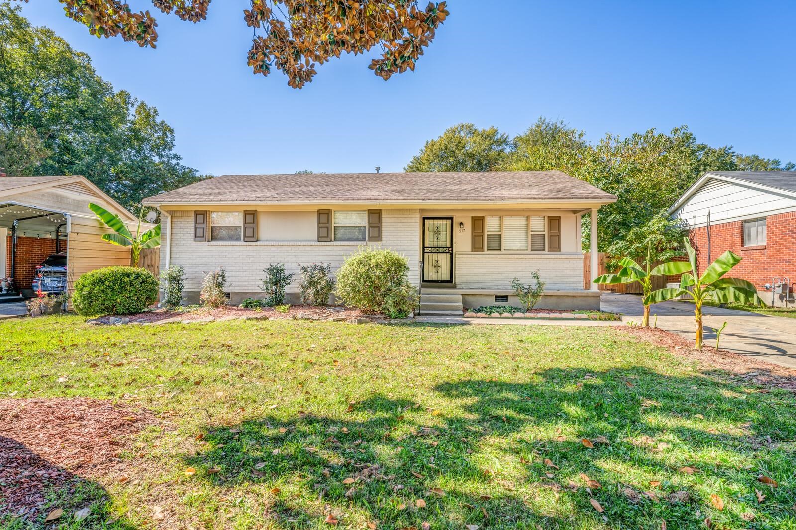 Ranch-style home featuring a front yard