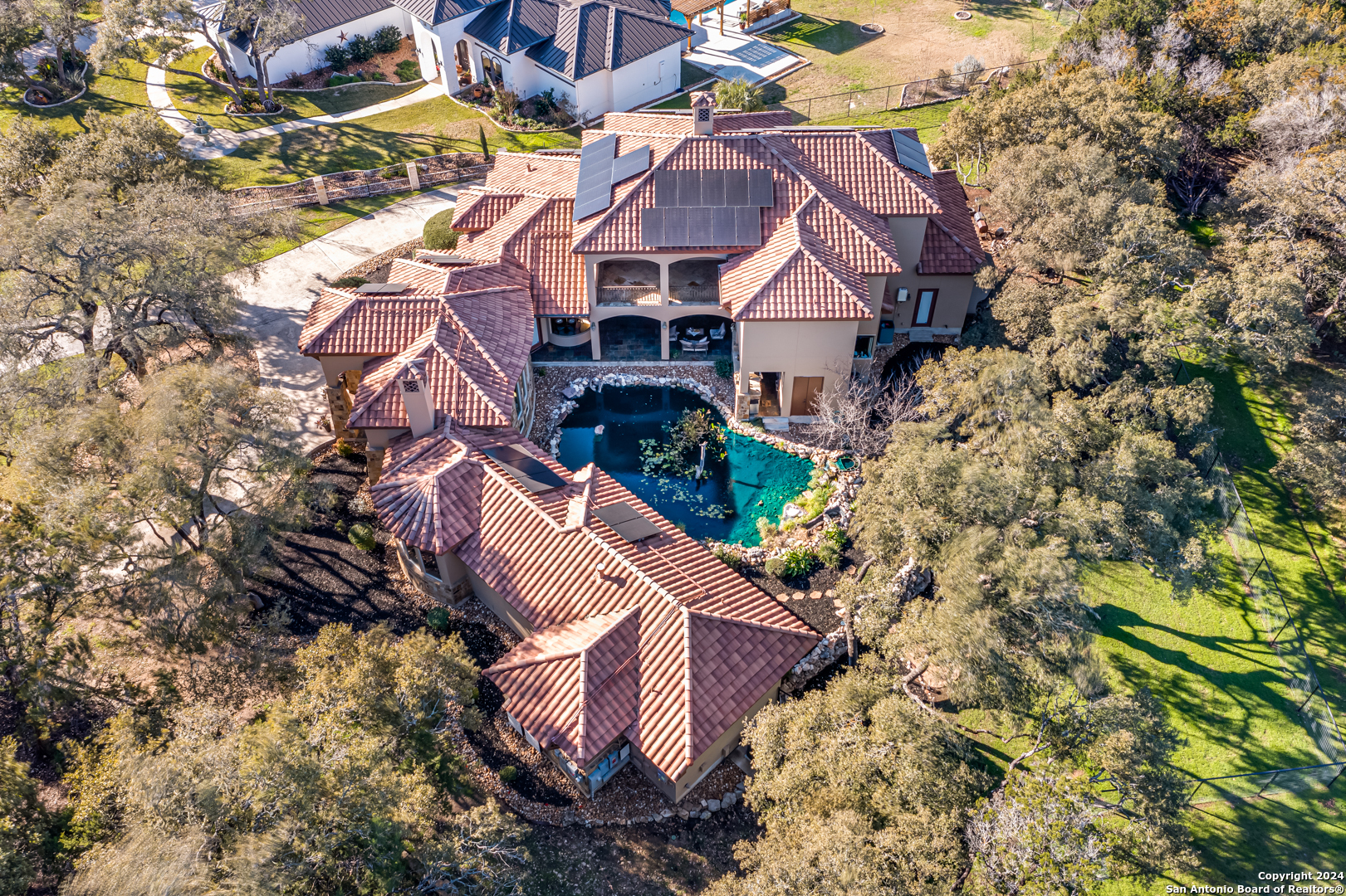 a aerial view of a house with a yard