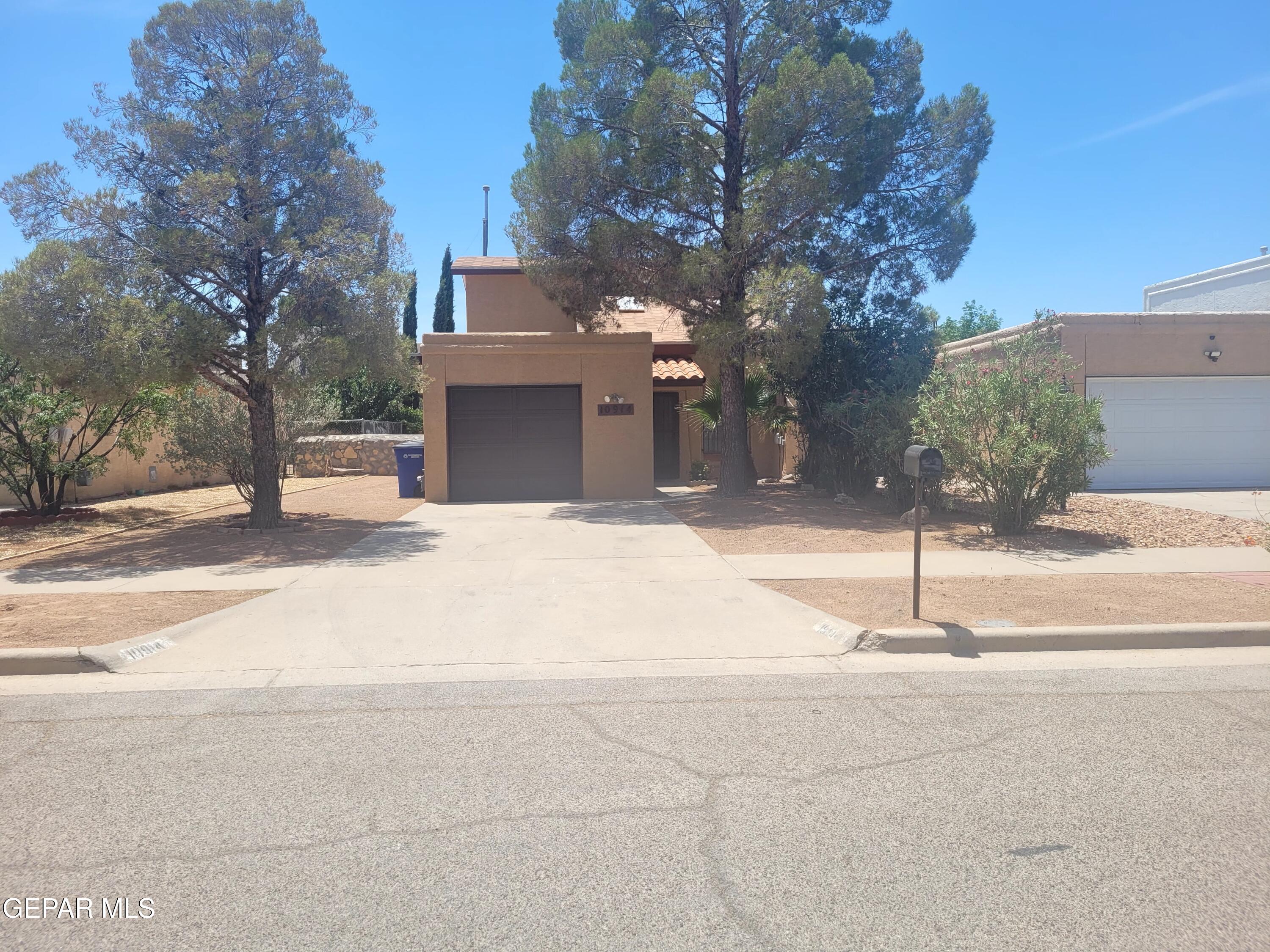 a house with trees in front of it