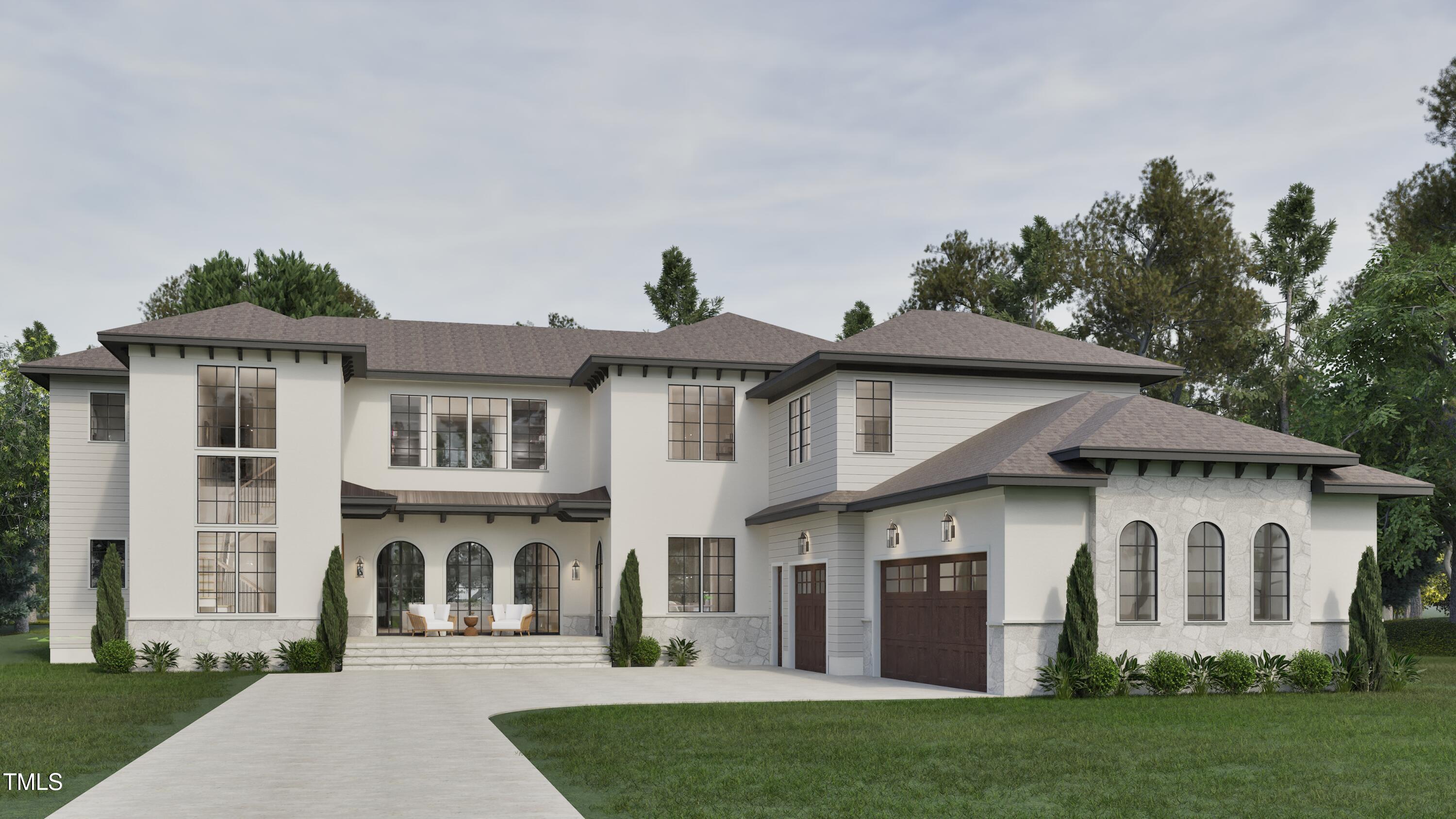 a front view of a house with a yard and trees