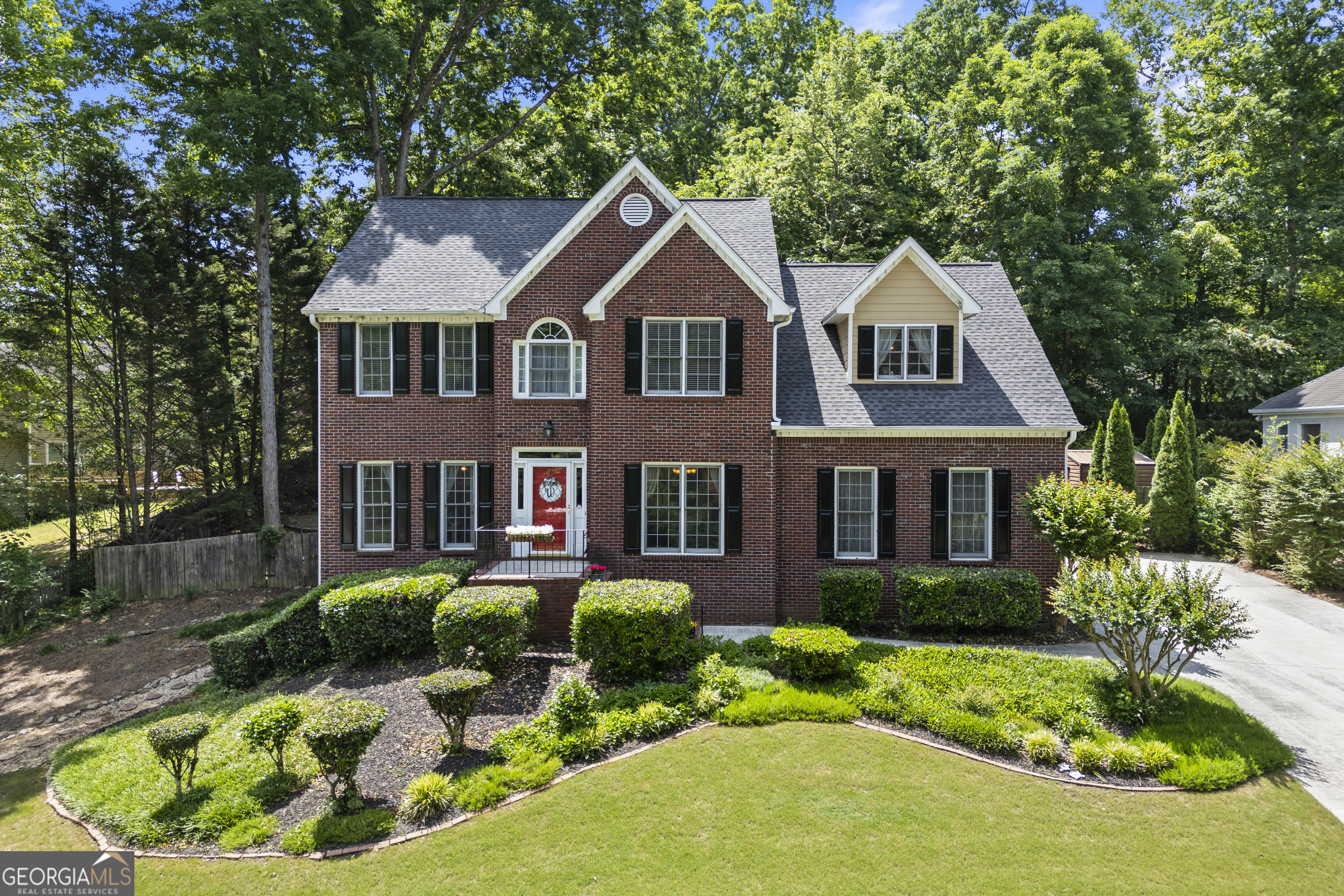 a front view of a house with a yard