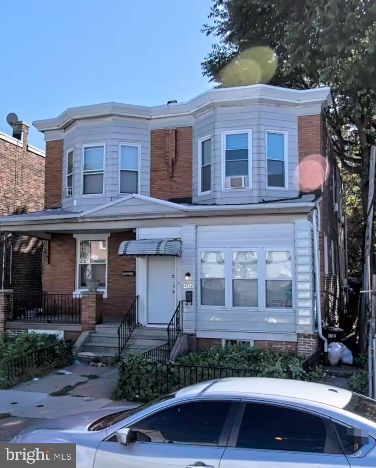 a front view of a house with yard