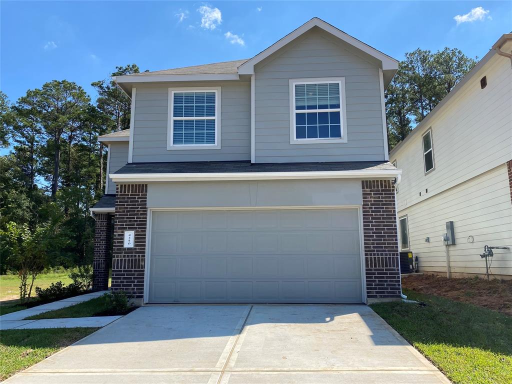 a view of a house with garage