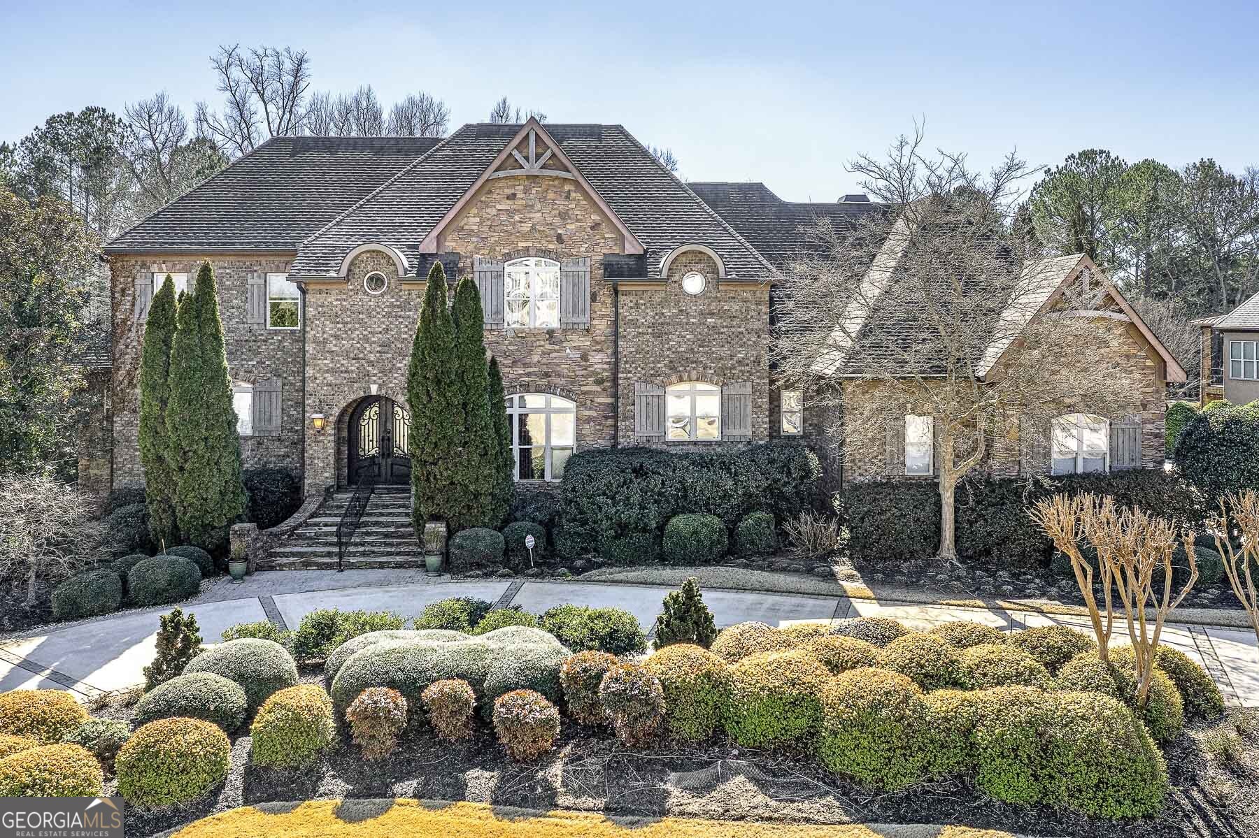 a front view of house with yard outdoor seating and barbeque oven