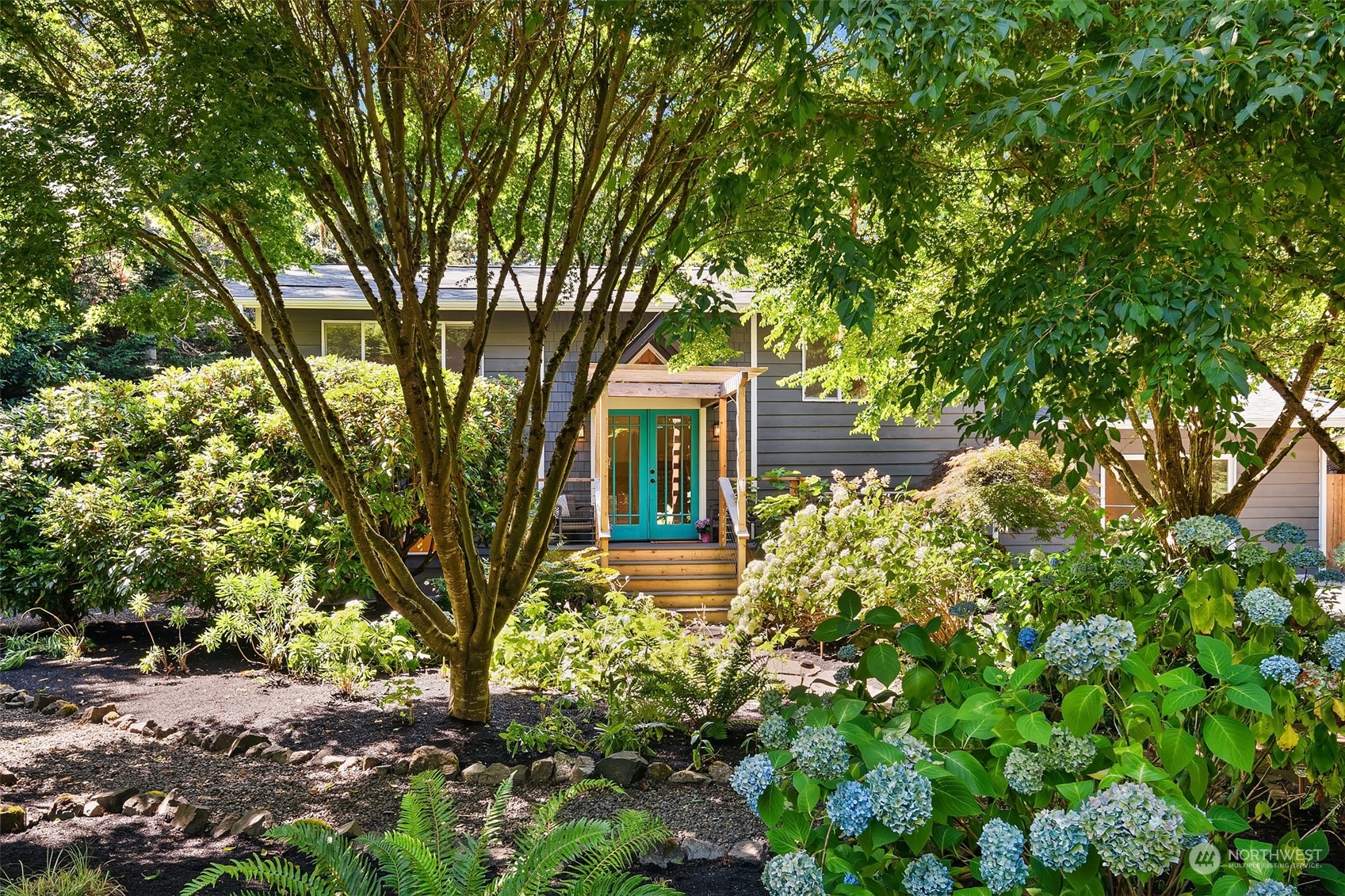 a front view of a house with garden