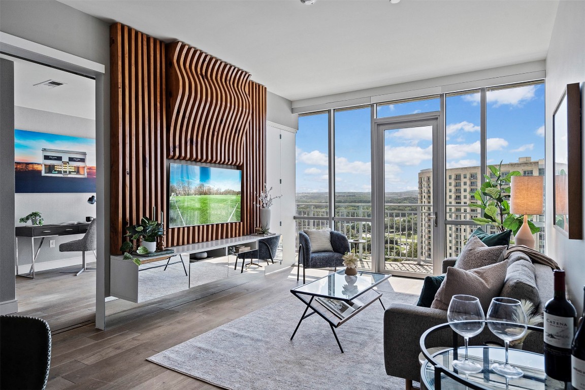 a living room with furniture and a large window