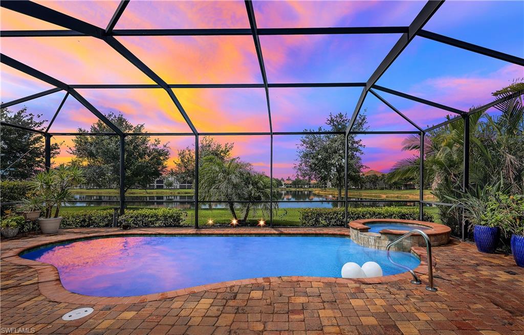 a view of swimming pool with a patio and a yard