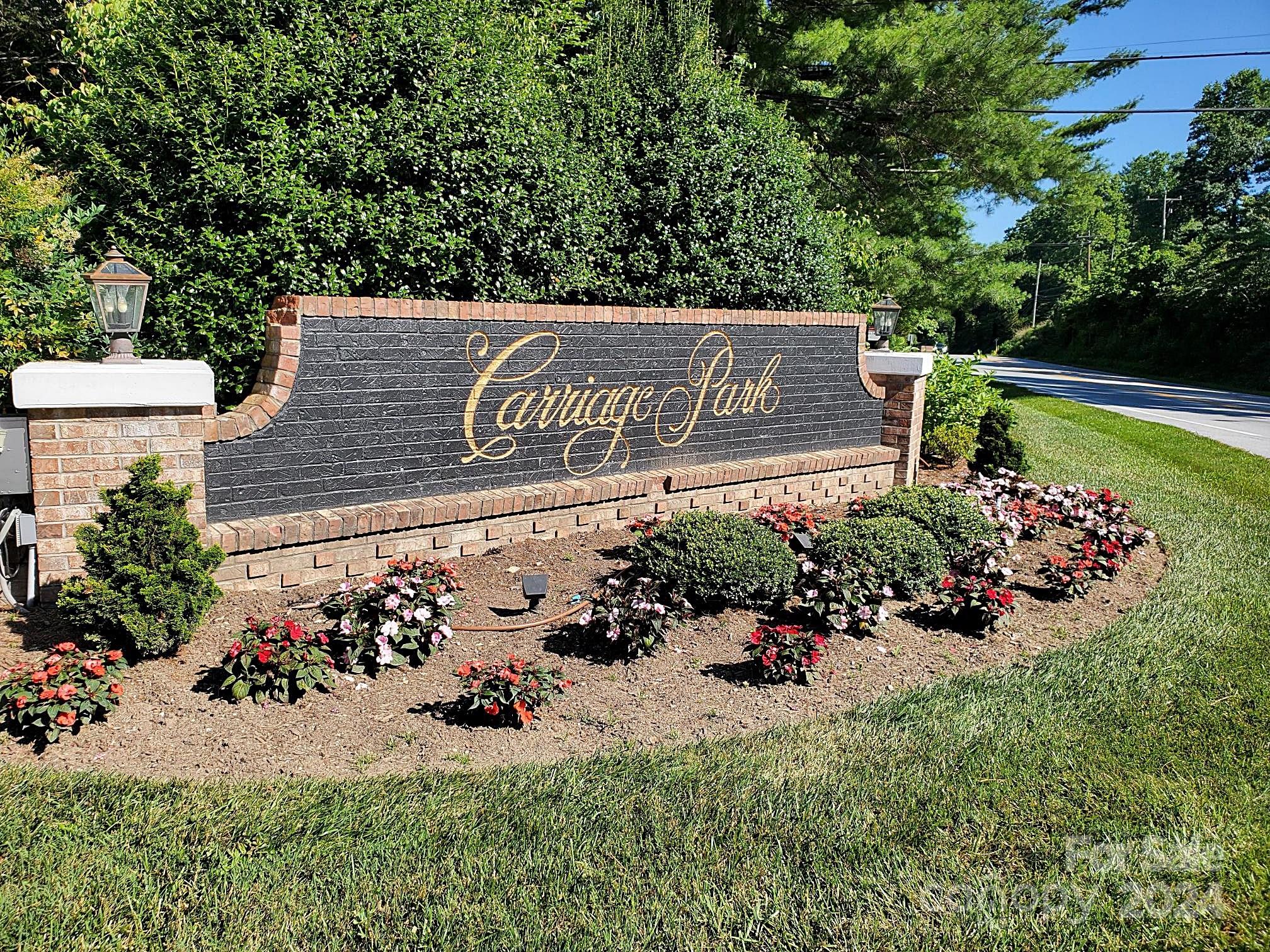 a view of a sign board with a yard