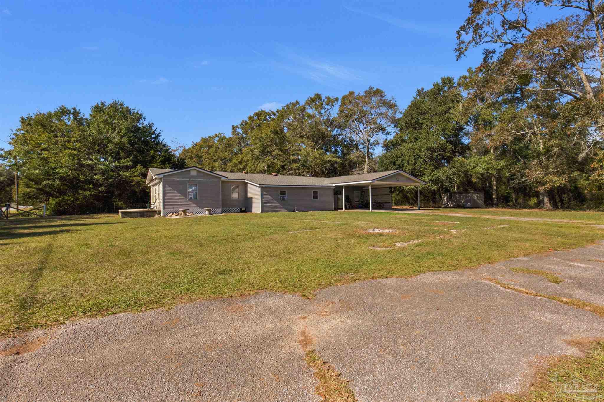 a house with trees in the background