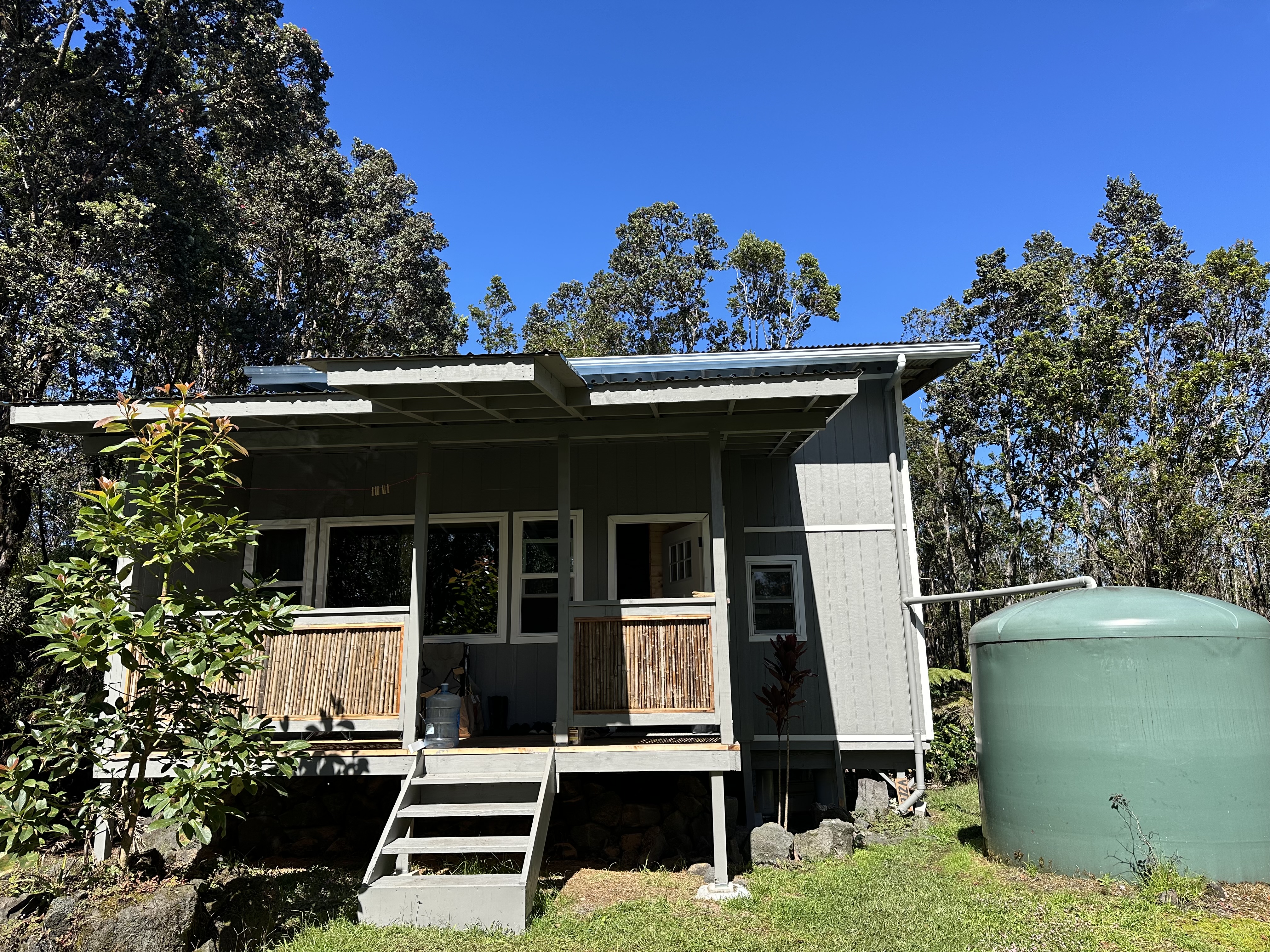 a view of a house with a door and a yard