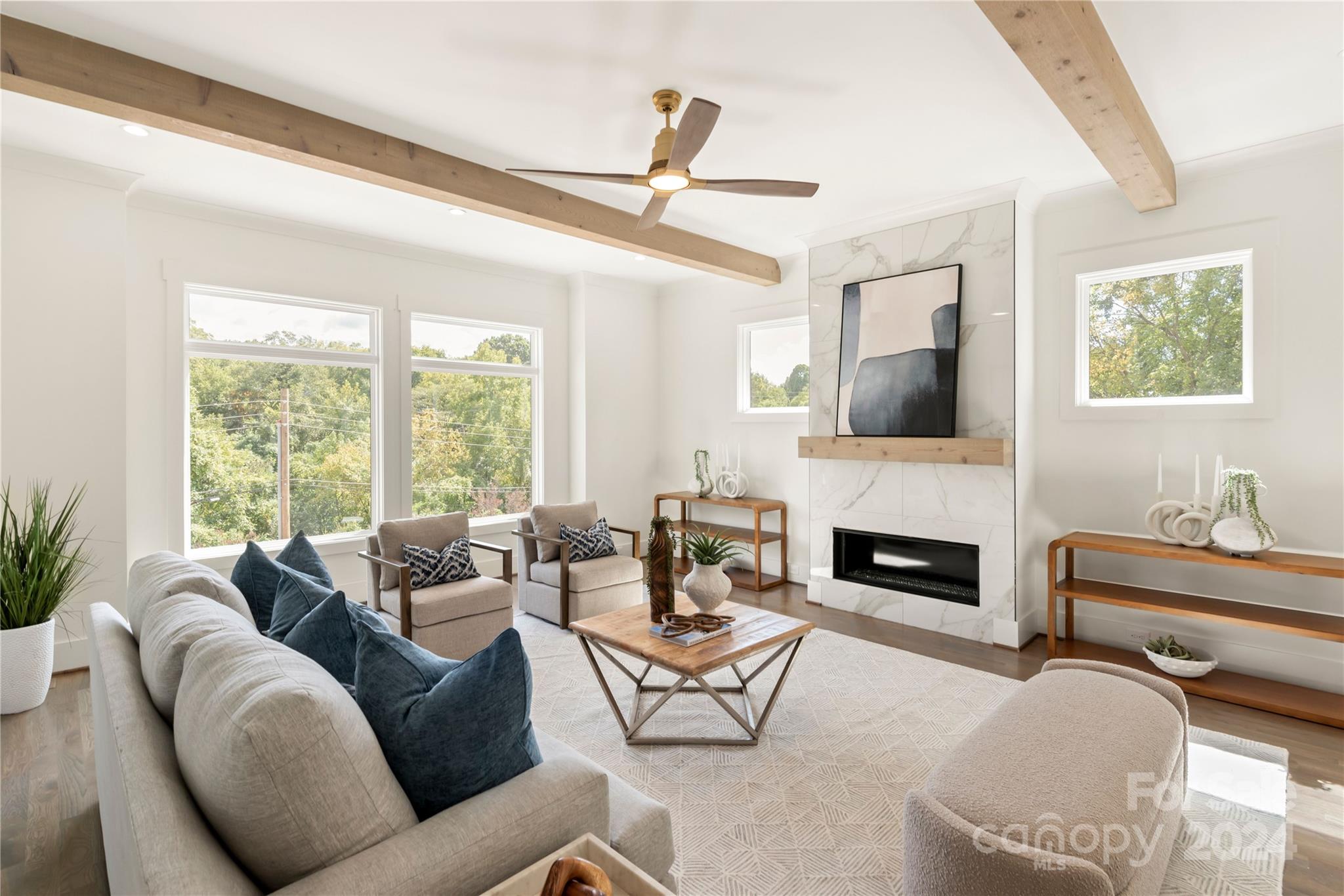 a living room with furniture fireplace and a flat screen tv