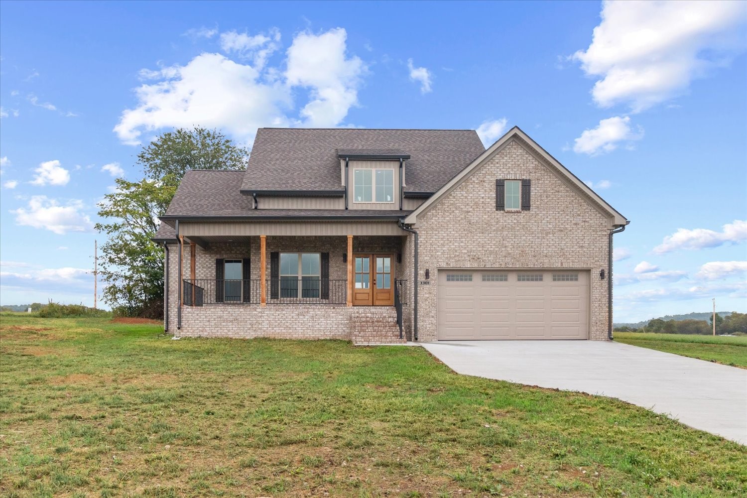 a front view of a house with a yard