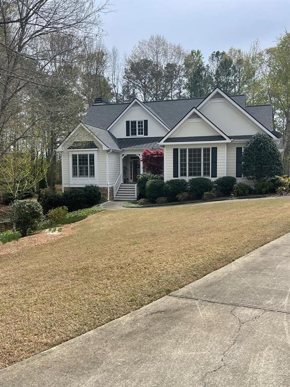 a front view of a house with a yard