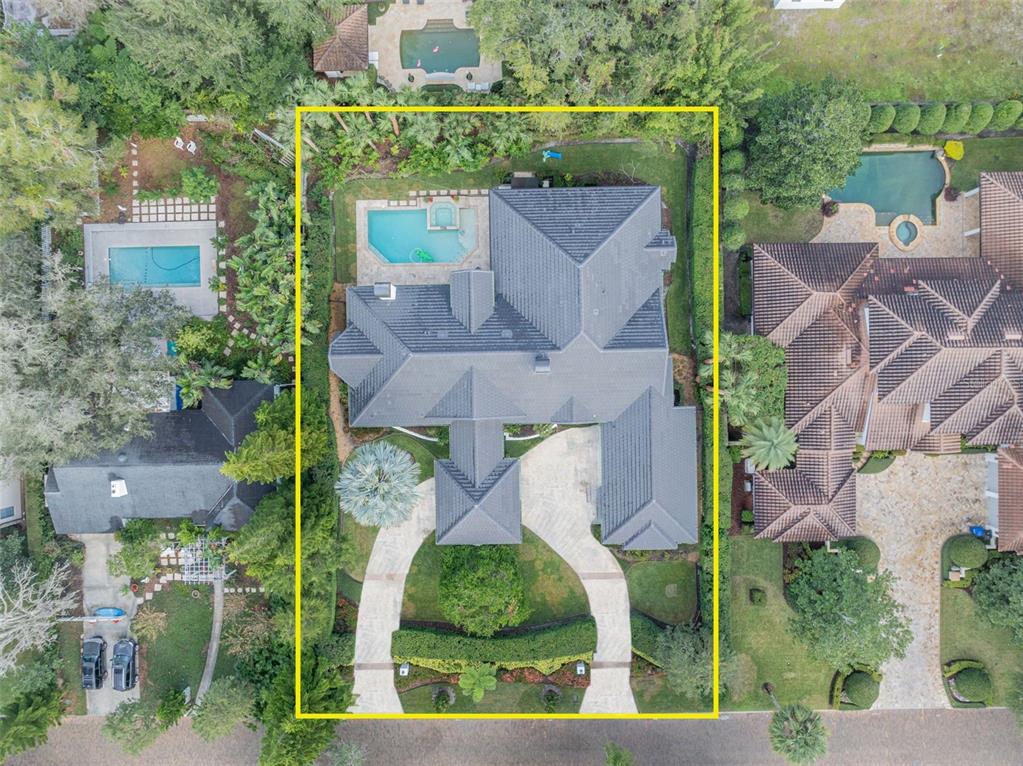 an aerial view of a house with a garden and plants