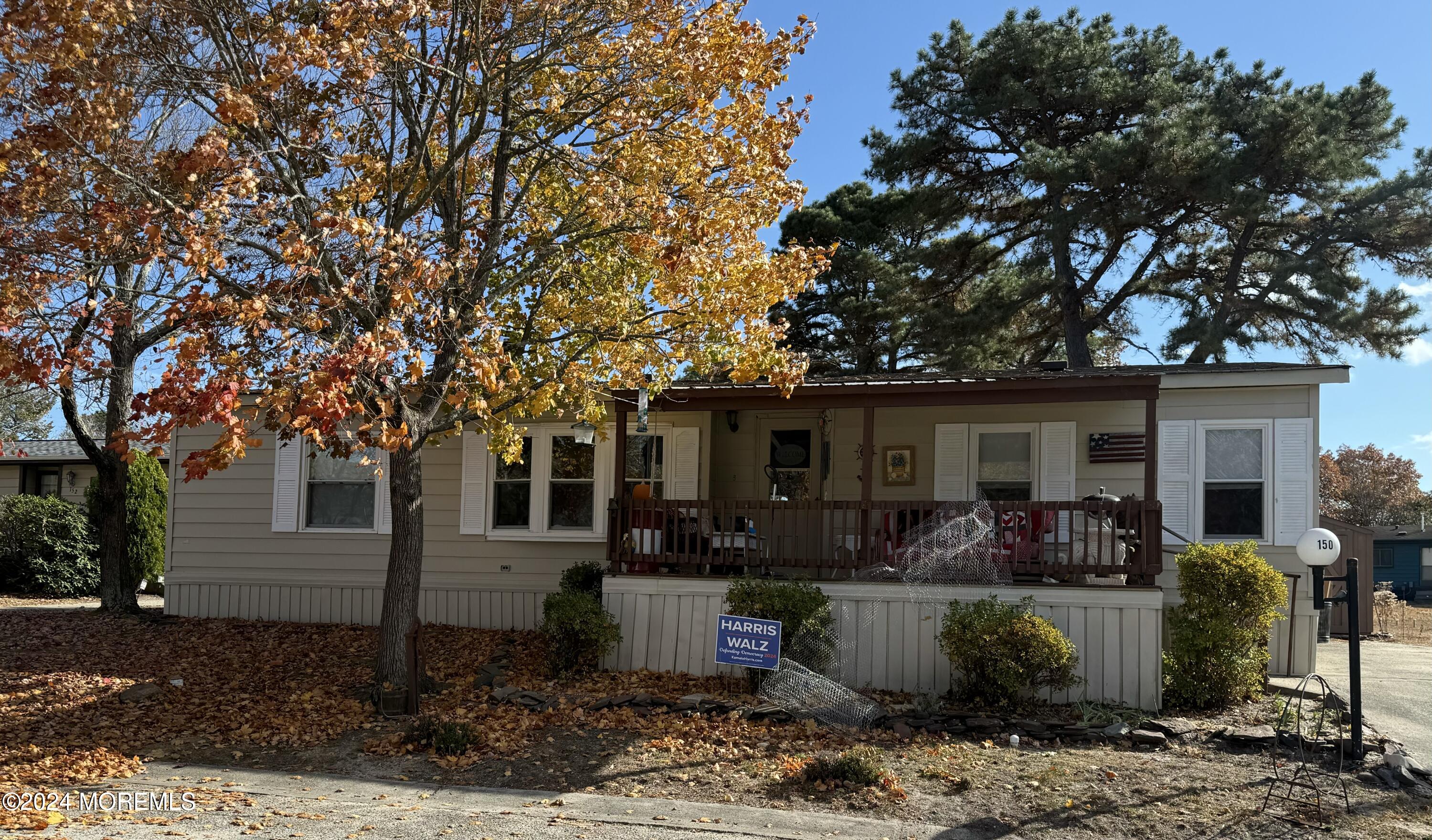 a front view of house with yard outdoor seating and barbeque oven