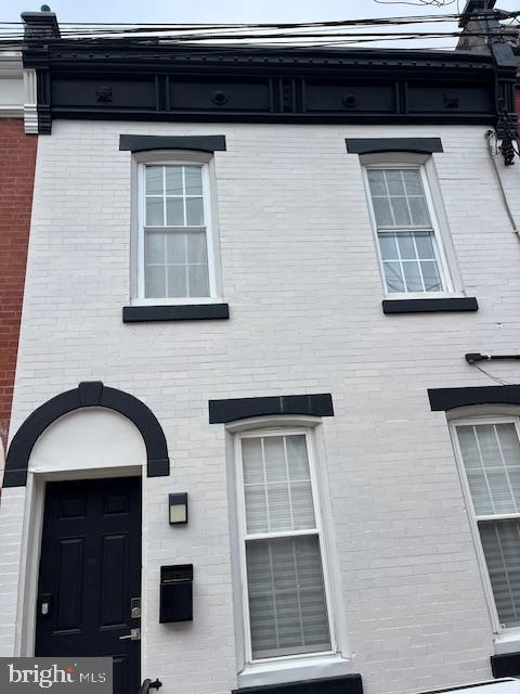 a front view of a house with windows