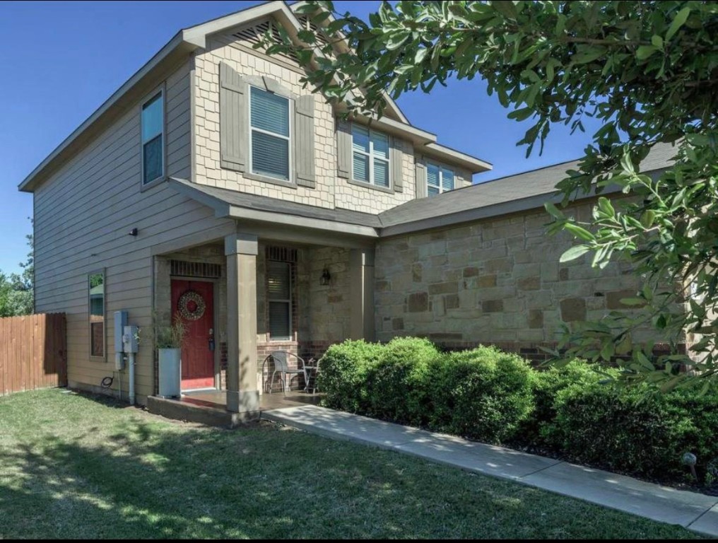 front view of a house with a yard