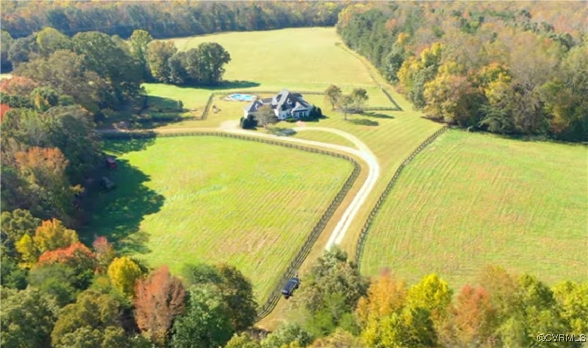 Birds eye view of property with a rural view