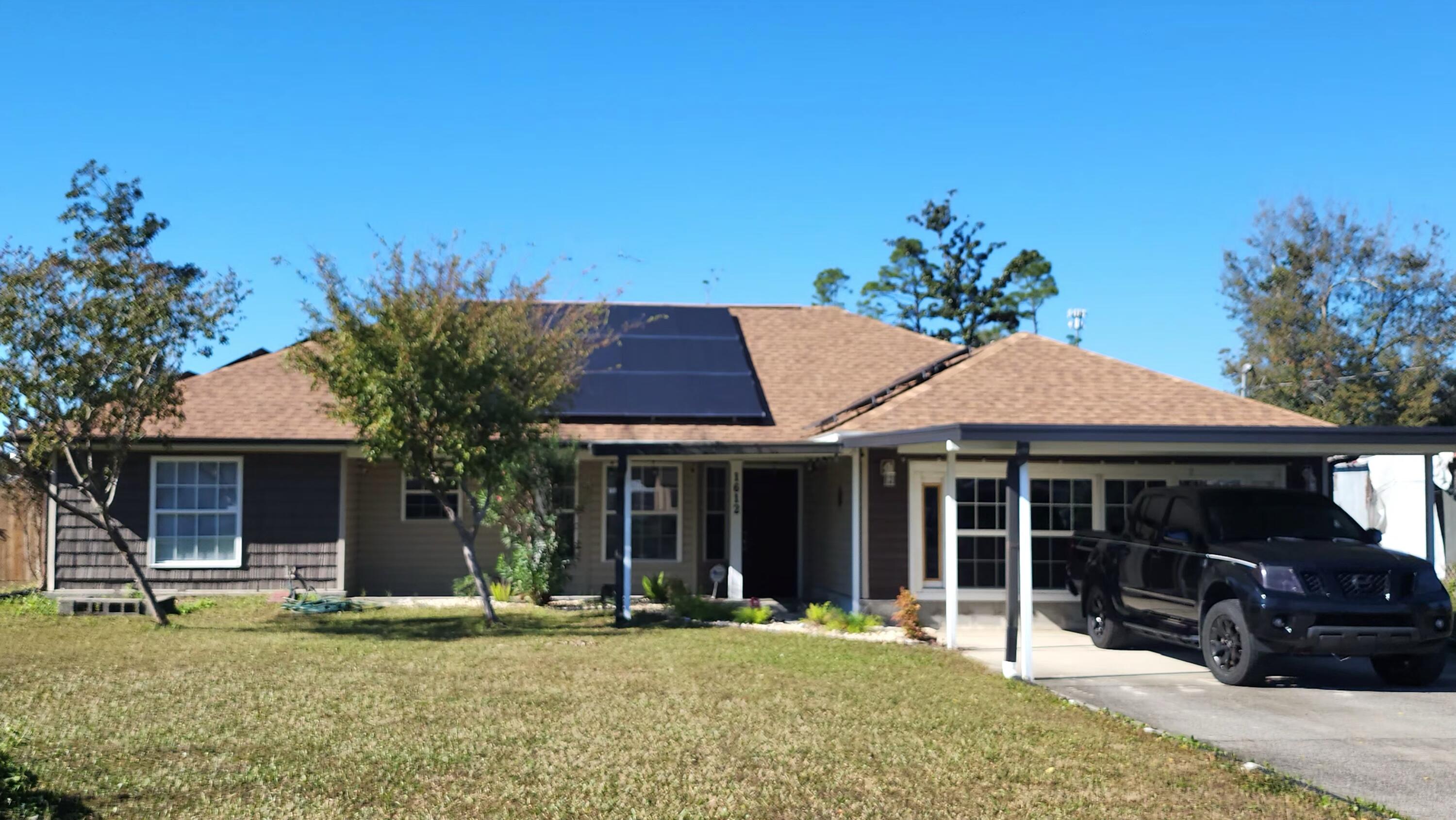 a front view of a house with a garden and porch