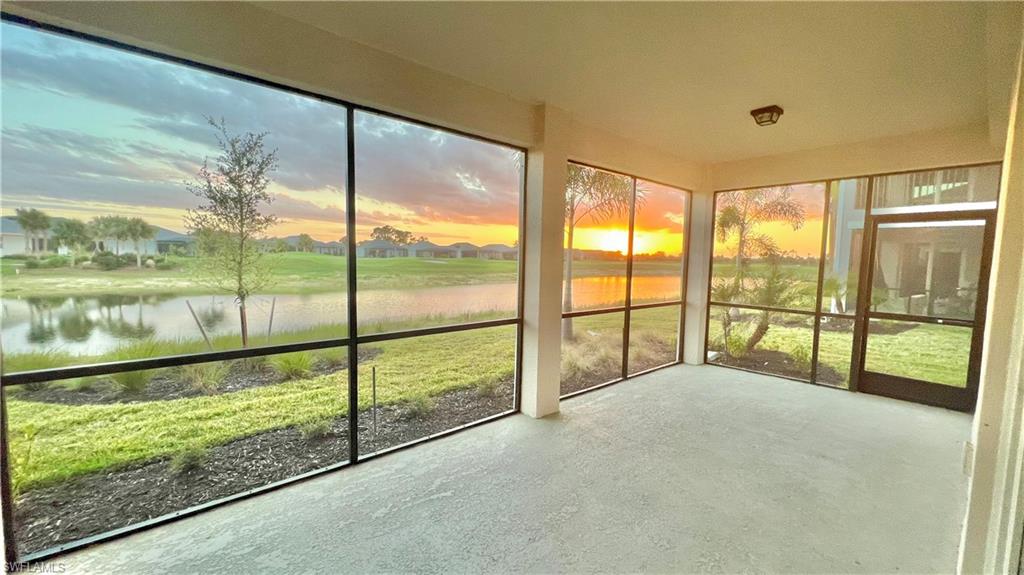 a view of an empty room wooden floor and a floor to ceiling window