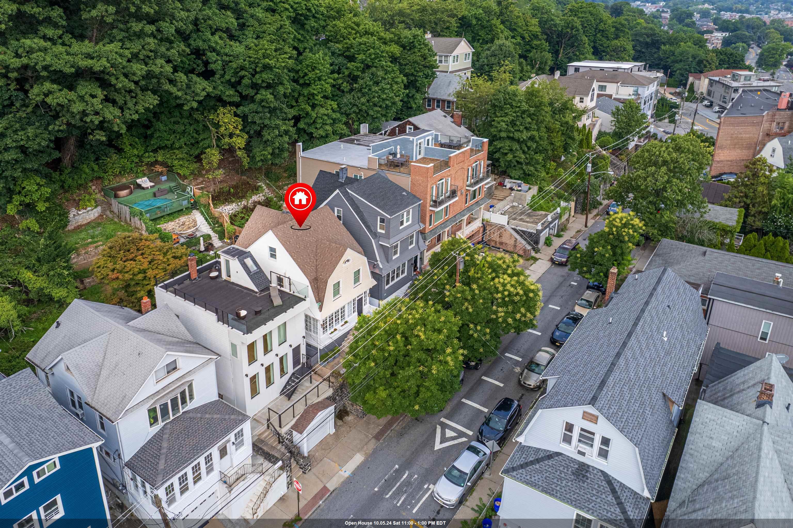 an aerial view of multiple houses with yard