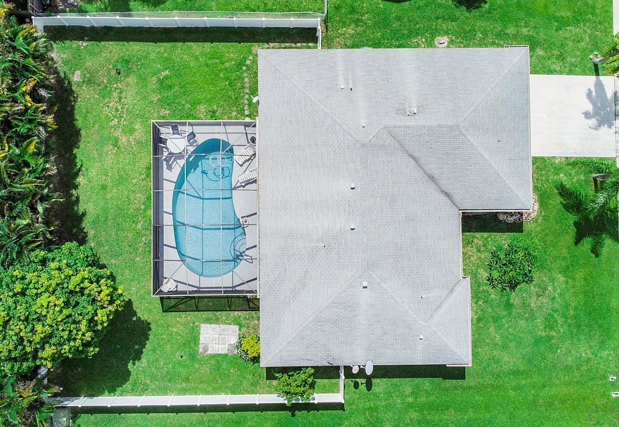 an aerial view of a house having yard