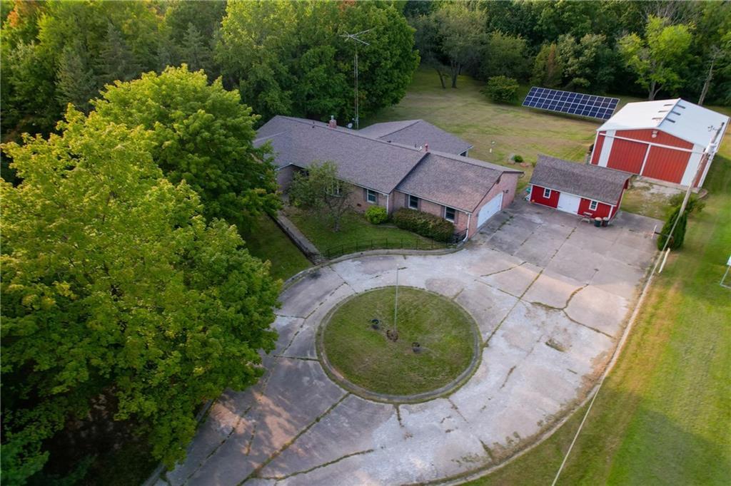 an aerial view of a house with outdoor space