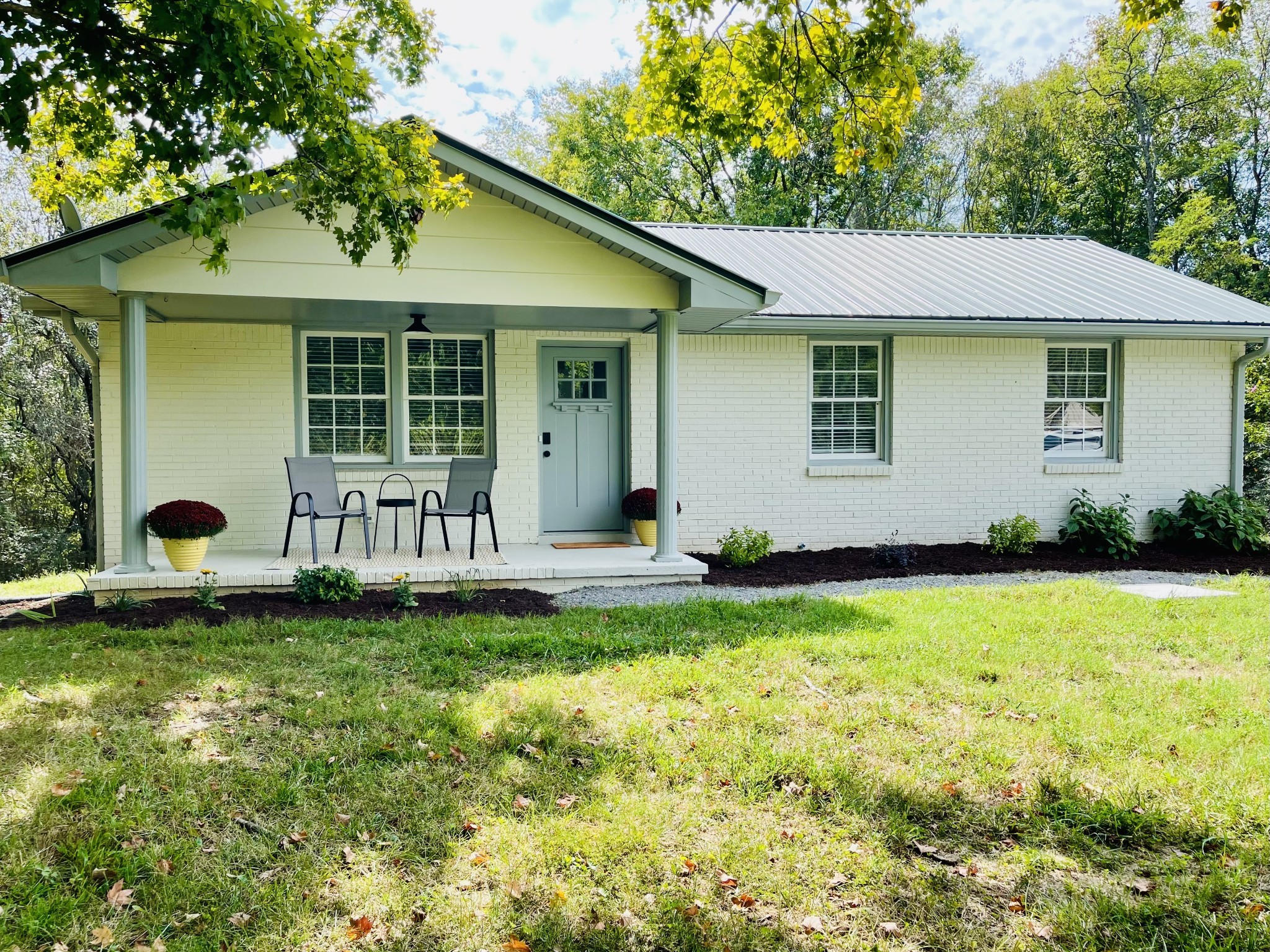 a front view of a house with a yard